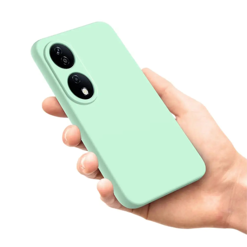 Mint vihreä silikonipuhelimen kuori, jossa kaksoiskameran aukot kädessä